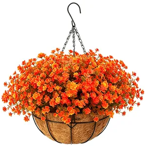 Detail of hanging basket with orange silk flowers and coco fiber liner on white background