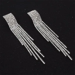 Detail view of silver long fringe earrings with multi-row white rhinestones
