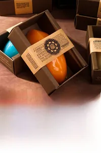 Macro detail of artisanal soap in premium industrial style kraft box packaging