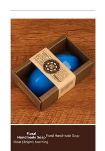 Macro detail of blue floral handmade soap in a rustic brown paper gift box packaging