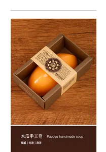 Detailed macro view of orange translucent papaya handmade soap in kraft paper packaging