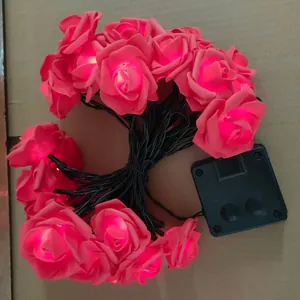 Pink LED solar rose string lights for garden decor with outdoor solar panel and controller