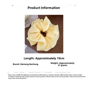 Detail view of yellow ruffled scrunchie with 19cm size and 31g weight specs