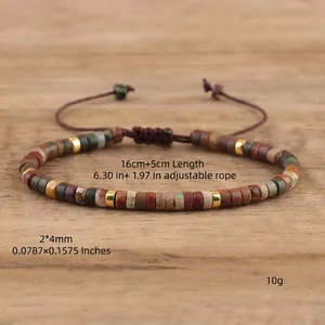 Bohemian imperial stone beaded adjustable bracelet with metallic spacers on wood