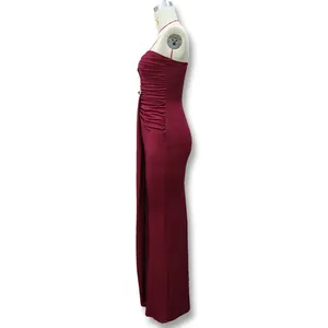 Detail of burgundy strapless dress featuring elegant side ruching and floor-length hem
