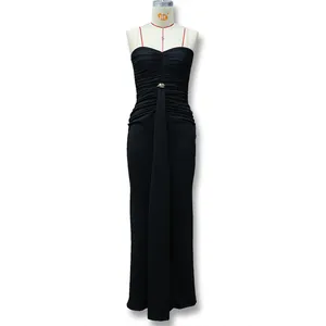 Detail of waist metal ring and elegant ruched pleats on black strapless evening dress