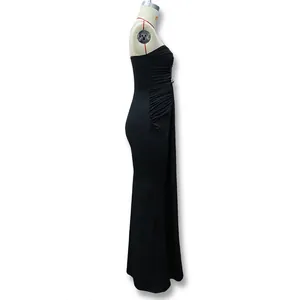 Detail view of black bodycon evening dress with side ruching and decorative buttons