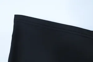 Detailed view of double-needle stitching on high-quality black textile fabric hem