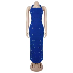 Detailed close-up of white bead embellishments on royal blue halter neck bodycon dress