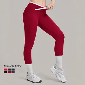 Leggings de yoga taille haute avec taille en V croisée, poches latérales et détails contrastés
