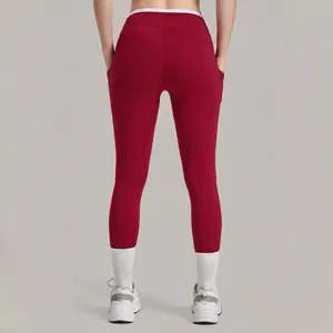 Leggings de yoga taille haute avec poches latérales et taille croisée pour le fitness