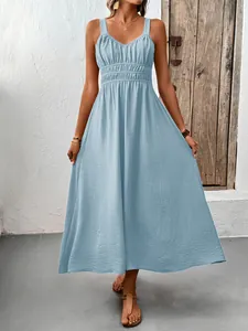 Detail of light blue sleeveless maxi dress with textured pleated fabric and V-neckline