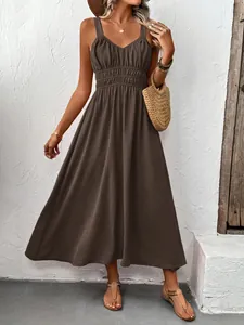 Detailed texture of dark brown V-neck sleeveless pleated maxi dress for summer