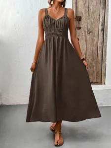 Detail of V-neck sleeveless maxi dress with smocked waist and textured fabric