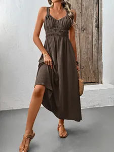 Detail of high-waist smocked texture on dark brown sleeveless summer maxi dress