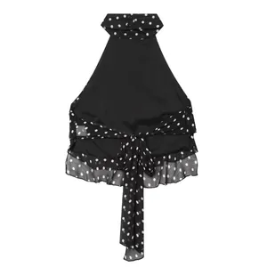 Haut licou élégant à pois noirs et blancs avec un gros nœud papillon au dos