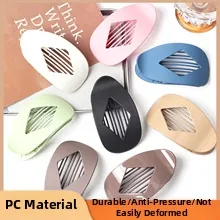 Detailed top view of colorful PC hair claws with matte and glossy finishes in drop shape