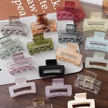 Detailed overhead view of assorted colorful square resin hair claws for women