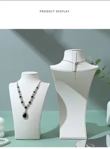 Close-up of elegant white PU leather necklace display bust stand for luxury jewelry
