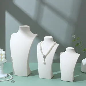 Three-piece white faux leather portrait neck bust stands for necklace and pendant display