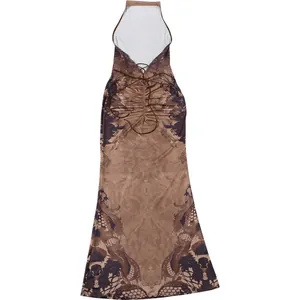 Detailed back view of halter dress featuring criss-cross lace-up straps and marble print