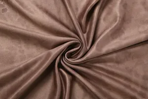 Detailed close-up of dark brown velvet fabric showing rich texture and glossy finish