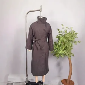 Women's autumn long wool blend coat featuring a high neck collar and matching waist belt