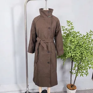 Elegant dark brown long coat with a high collar and waist belt on a studio mannequin