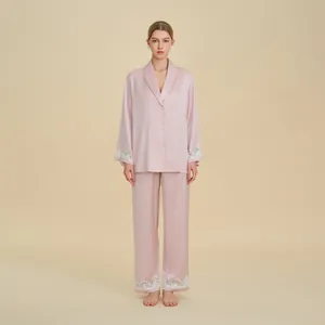 Elegant satin pajama set for women featuring lace cuffs and long pants in dusty rose