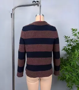 Detail shot of the back of a navy and rust striped crewneck sweater on a mannequin