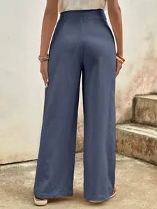 Rear view of high-waisted grey-blue wide-leg cotton trousers with natural texture