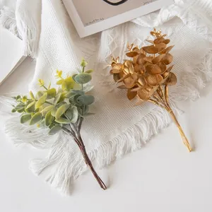 Artificial gold and green eucalyptus leaves for Nordic home decor and floral arrangement