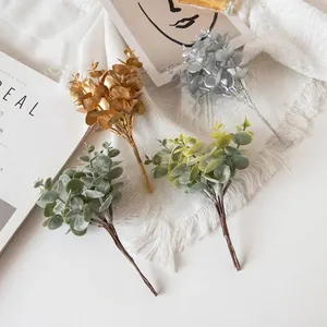 Artificial eucalyptus leaves in gold, silver, and green for modern home vase decoration