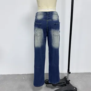Rear view of vintage slim-fit men's jeans with faded wash and back pockets