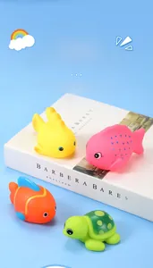 Set of four colorful rubber sea animal toys including fish and a green turtle for bath time