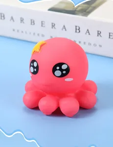 Close-up of pink cartoon octopus squeeze toy with soft texture and cute star detail