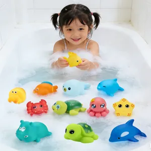 Colorful ocean animal bath toy set with dolphin and starfish shown in a bubbly bathtub