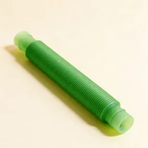 Detailed view of flexible green pop tube sensory toy with textured plastic surface
