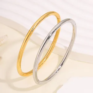 Polished titanium steel bracelets in gold and silver with unique sliding groove design