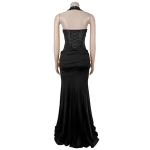 Detail of the backless halter evening dress with shimmering sequins and lace-up back