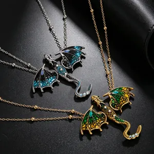 Close-up of enamel dragon pendants with sparkling rhinestones and detailed wings