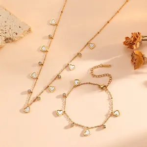 Detailed view of 18k gold plated stainless steel heart necklace and bracelet set
