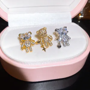 Detail macro view of cute teddy bear ear clips with sparkling crystal rhinestones