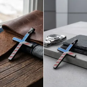 Detail of a stainless steel cross pendant featuring an American flag enamel design.