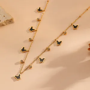 Elegante collana a farfalla in acciaio inossidabile dorato con ciondoli neri e cristalli