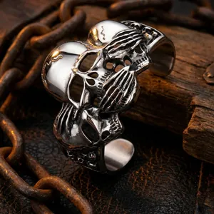 Macro shot of silver stainless steel skull cuff with vintage gothic distressed details