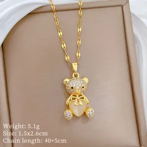 Detailed specs of the gold bear pendant with crystal stones and heart opal stone