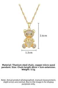 Detail of teddy bear pendant with heart opal and dimensions 2.6x1.5cm on steel chain