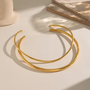 Minimalist golden titanium steel open choker necklaces with polished finish on stone base