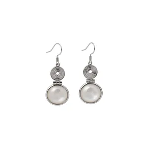 Minimalist modern silver-toned hook earrings with white resin circular drop pendant